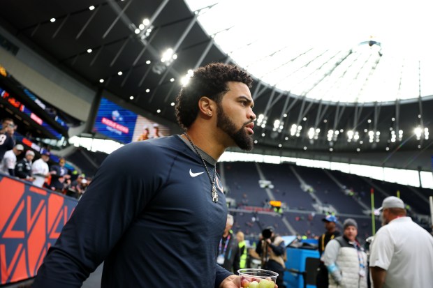 Chicago Bears quarterback Caleb Williams walks out onto the field to warm up for a game against the Jacksonville Jaguars at Tottenham Hotspur Stadium in London on Oct. 13, 2024. (Chris Sweda/Chicago Tribune)