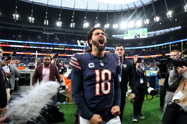 Bears quarterback Caleb Williams celebrates as he heads to the locker room after a victory over the Jaguars at Tottenham Hotspur Stadium in London on Oct. 13, 2024. (Chris Sweda/Chicago Tribune)