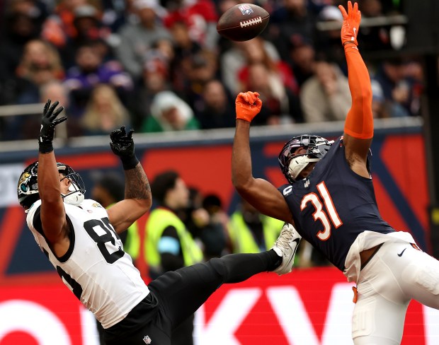 Bears safety Kevin Byard III, 31, knocks a ball away from Jaguars tight end Brenton Strange in the end zone in the third quarter at Tottenham Hotspur Stadium in London on Oct. 13, 2024. (Chris Sweda/Chicago Tribune)