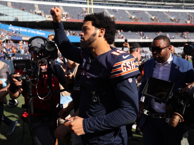 Chicago Bears quarterback Caleb Williams (18) celebrates as he heads to the locker room after a victory over the Carolina Panthers at Soldier Field in Chicago on Oct. 6, 2024.  (Chris Sweda/Chicago Tribune)