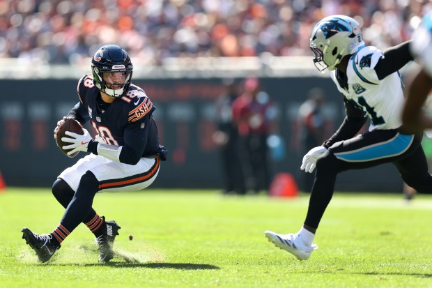 Bears quarterback Caleb Williams eludes the Panthers defense in the second quarter at Soldier Field on Oct. 6, 2024. (Chris Sweda/Chicago Tribune)