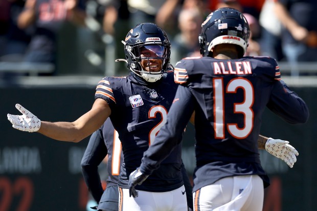 Bears wide receivers DJ Moore (2) and Keenan Allen celebrate after Moore scored a touchdown against the Panthers at Soldier Field on Oct. 6, 2024. (Chris Sweda/Chicago Tribune)