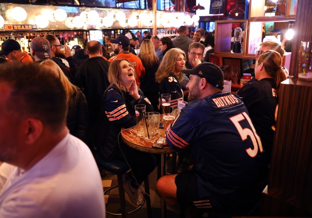 Bears fans relax at the Greenwood Sports Pub on Oct. 11, 2024, in London. (Chris Sweda/Chicago Tribune)