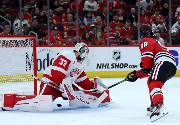 Detroit Red Wings goaltender Sebastian Cossa (33) blocks the shot of Chicago Blackhawks center Connor Bedard (98) in the third period of a preseason game at the United Center in Chicago on Sept. 25, 2024. (Chris Sweda/Chicago Tribune)