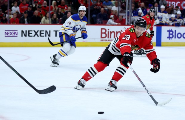 Blackhawks center Philipp Kurashev tries to intercept a pass in the first period against the Sabres on Oct. 19, 2024, at the United Center. (Chris Sweda/Chicago Tribune)