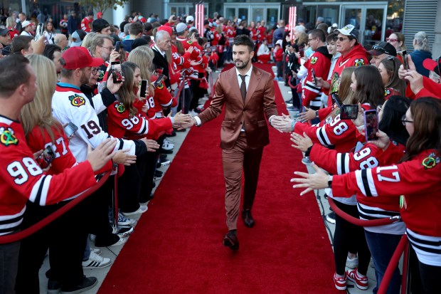 Chicago Blackhawks goaltender Petr Mrazek walks the red carpet before the Blackhawks home opener against the San Jose Sharks at the United Center in Chicago on Oct. 17, 2024. (Chris Sweda/Chicago Tribune)