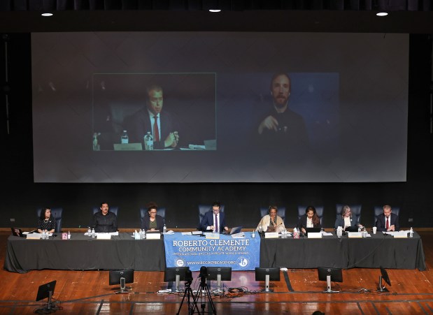 Chicago Public Schools CEO Pedro Martinez, seated far right, speaks during a Chicago Board of Education meeting at Roberto Clemente Community Academy on Sept. 26, 2024. (Chris Sweda/Chicago Tribune)