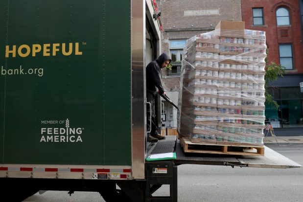 Driver Max Perea, from the Greater Chicago Food Depository, delivers food to Common Pantry on Oct. 14, 2024. "Recalls affect us more because it's a product that we would've been receiving, then that product goes away," said Common Pantry executive director Margaret O'Conor. (Antonio Perez/Chicago Tribune)