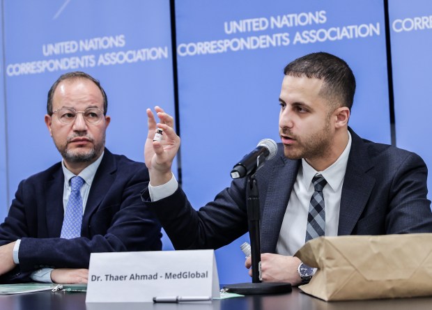 Dr. Zaher Sahloul listens as Dr. Thaer Ahmad, who has worked on the frontlines of medical care in Gaza, talks to the press at the United Nations in New York on March 19, 2024. They discussed the worsening health care emergency caused by the war and urge action to improve health care access and protection in Gaza. (Selcuk Acar/Anadolu)