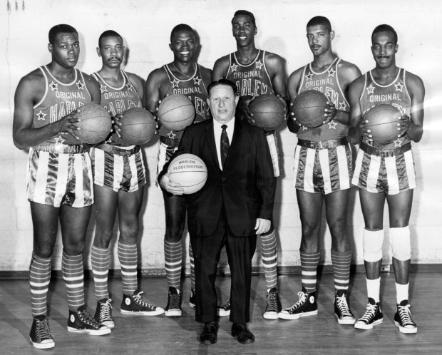 Coach Abe Saperstein and his Chicago-based Harlem Globetrotters before a trip to London in 1963. From left to right are Howard Montgomery, Jackie Jackson, J.C. Gipson, Bill "The Orbit" Garner, Walter Kennedy and Murphy Summons. (Tribune archive photo)