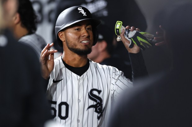 White Sox infielder Lenyn Sosa is congratulated in the dugout after scoring against the Angels on Sept. 24, 2024, at Guaranteed Rate Field. (Chris Sweda/Chicago Tribune)