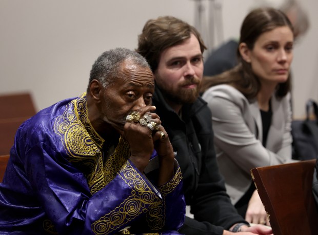 Jackie Wilson, right, along with law student Andrew Garden and attorney Katie Montenegro, listen to the testimony of Wilson's attorney, Elliot Slosar, during the trial of former Cook County assistant state's attorneys, Nicholas Trutenko, 69, and Andrew Horvat, 48, at the courthouse in Rolling Meadows on Oct. 24, 2024. (Stacey Wescott/Chicago Tribune)