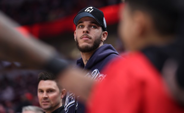 Injured Bulls guard Lonzo Ball stands on the court just before tipoff of a game against the Kings at the United Center on Feb. 3, 2024. (Chris Sweda/Chicago Tribune)