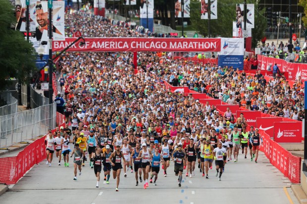 Thousands of runners head north on Columbus Avenue in Grant Park to start the Chicago Marathon on Oct. 8, 2023. (Eileen T. Meslar/Chicago Tribune)