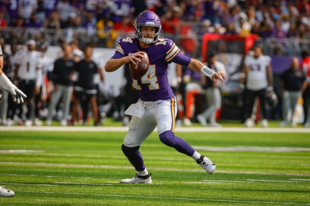 Vikings quarterback Sam Darnold scrambles against the Texans during the first half on Sept. 22, 2024, in Minneapolis. (AP Photo/Bruce Kluckhohn)