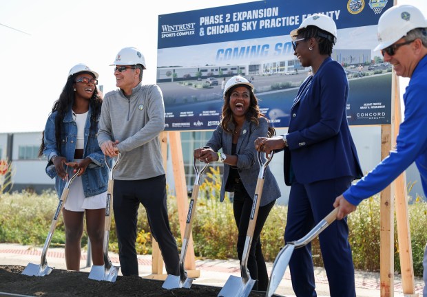 Chicago Sky players Michaela Onyenwere, left, and Elizabeth Williams, second from right, stand with principal owner Michael Alter, second from left, co-owner and operating chairman Nadia Rawlinson, and owner Harvey Alter to break ground on the new Chicago Sky practice facility in Bedford Park on Wednesday, Oct. 9, 2024. (Eileen T. Meslar/Chicago Tribune)