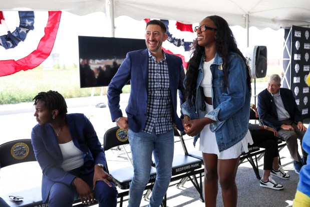 Chicago Sky general manager Jeff Pagliocca stands with player Michaela Onyenwere during a groundbreaking for the new Chicago Sky practice facility in Bedford Park on Wednesday, Oct. 9, 2024. (Eileen T. Meslar/Chicago Tribune)