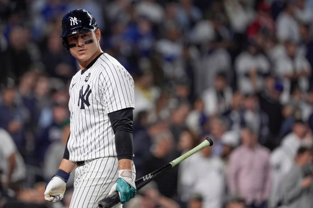 The Yankees' Anthony Rizzo walks back to the dugout after striking out to end the 8th inning in Game 5 of the World Series on Oct. 30, 2024, in New York. (AP Photo/Godofredo A. Vásquez)