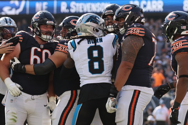 Jaycee Horn #8 of the Carolina Panthers and Matt Pryor #79 of the Chicago Bears are involved in a altercation during the fourth quarter at Soldier Field on Oct. 06, 2024 in Chicago, Illinois. (Photo by Michael Reaves/Getty Images)