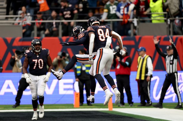 Keenan Allen and Marcedes Lewis of Chicago Bears celebrate during the NFL match between Jacksonville Jaguars and Chicago Bears at Tottenham Hotspur Stadium on Oct. 13, 2024 in London, England. (Photo by Richard Heathcote/Getty Images)