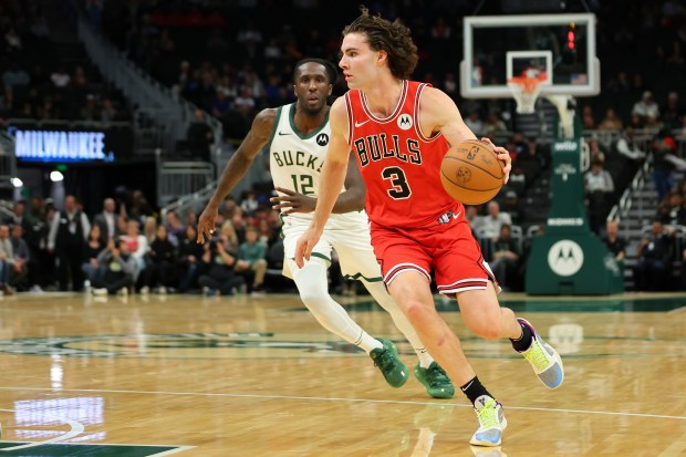 Josh Giddey #3 of the Chicago Bulls drives around Taurean Prince #12 of the Milwaukee Bucks during the first half of a preseason game at Fiserv Forum on Oct. 14, 2024 in Milwaukee, Wisconsin. NOTE TO USER: User expressly acknowledges and agrees that, by downloading and or using this photograph, User is consenting to the terms and conditions of the Getty Images License Agreement. (Photo by Stacy Revere/Getty Images)