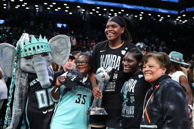 Jonquel Jones #35 of the New York Liberty poses for a photo with the WBNA Finals MVP trophy after winning Game Five of the WNBA Finals at Barclays Center on Oct. 20, 2024 in New York City. (Photo by Elsa/Getty Images)