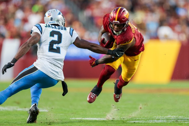 Brian Robinson Jr. #8 of the Washington Commanders runs the ball against the Carolina Panthers during the third quarter at FedExField on Oct. 20, 2024 in Landover, Maryland. (Photo by Patrick Smith/Getty Images)