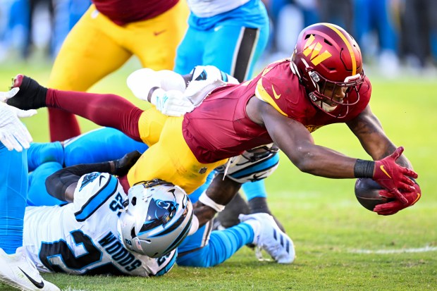 Brian Robinson Jr. #8 of the Washington Commanders scores touchdown against the Carolina Panthers during the second quarter at FedExField on Oct. 20, 2024 in Landover, Maryland. (Photo by Greg Fiume/Getty Images)