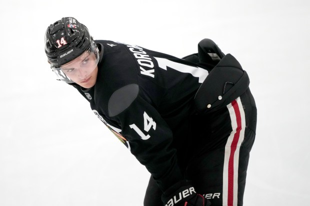 Chicago Blackhawks defenseman Kevin Korchinski takes a break during the team's NHL hockey camp Thursday, Sept. 19, 2024, in Chicago. (AP Photo/Charles Rex Arbogast)