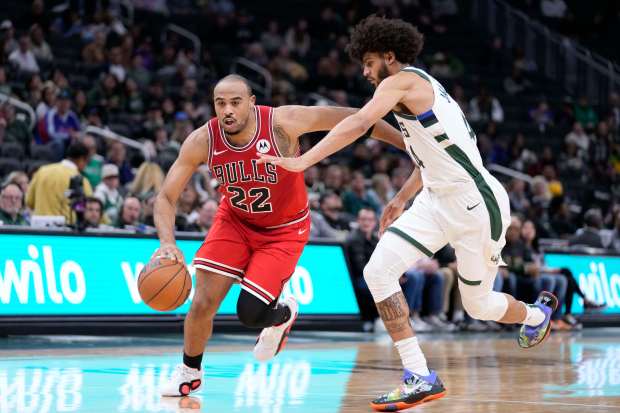 Chicago Bulls' Talen Horton-Tucker (22) dribbles the ball against the Milwaukee Bucks' Andre Jackson Jr. during the second half of an NBA preseason basketball game Monday, Oct. 14, 2024, in Milwaukee. (AP Photo/Kayla Wolf)