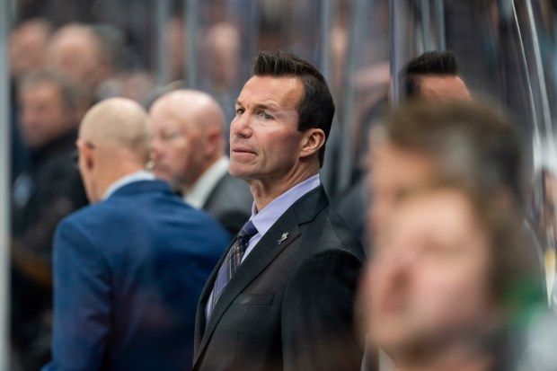 Blackhawks coach Luke Richardson watches from the bench during the third period of a game against the Utah Hockey Club on Oct. 8, 2024, in Salt Lake City. (Spenser Heaps/AP)