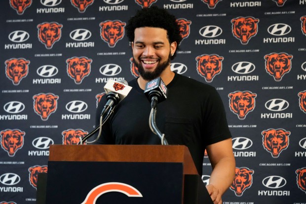 Chicago Bears quarterback Caleb Williams smiles as he talks with reporters after an NFL football game against the Carolina Panthers in Chicago, Sunday, Oct. 6, 2024. (AP Photo/Nam Y. Huh)