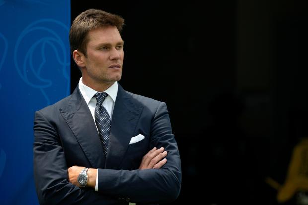 Tom Brady watches warmups before a preseason game between the Cowboys and Rams on Aug. 11, 2024, in Inglewood, Calif. (AP Photo/Gregory Bull)