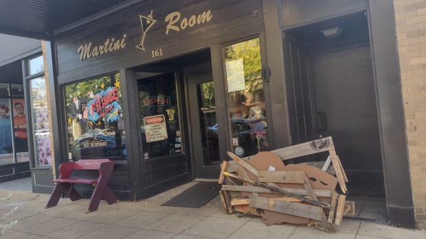 The Martini Room on East Chicago Street was one of the first places to starting being decorated Friday in advance of Nightmare on Chicago Street in downtown Elgin. The zombie-themed street party will be held on Oct. 18. (Mike Danahey/The Courier-News)