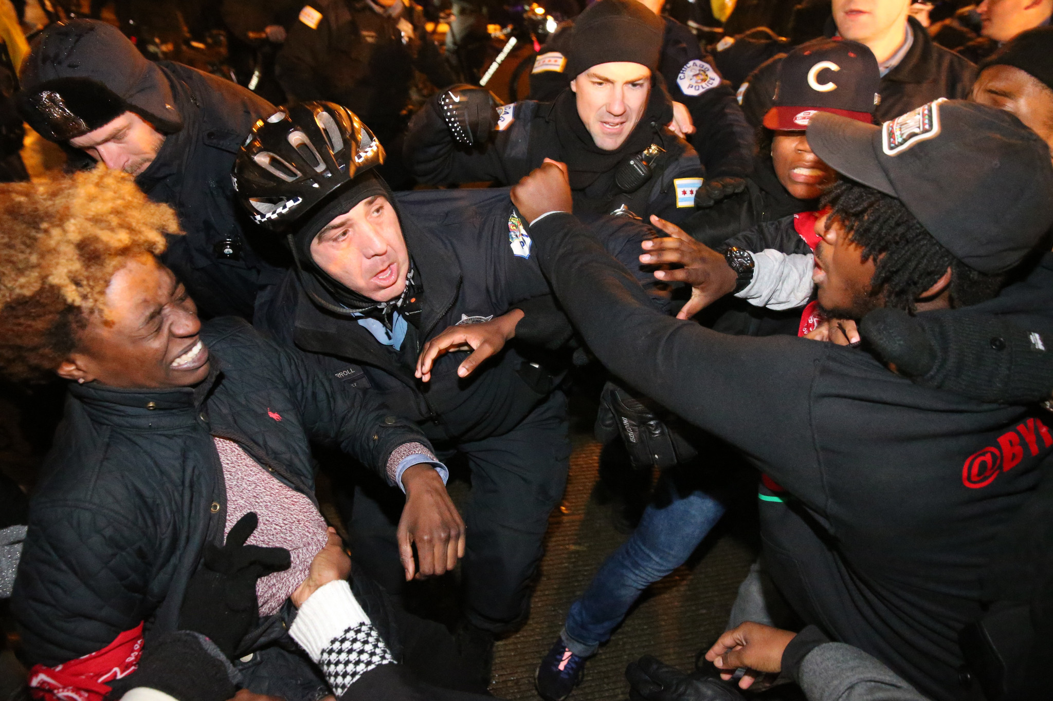 A scuffle breaks out as Chicago police try to stop...