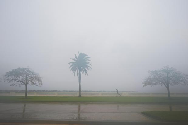 A jogger trots as rain falls ahead of the arrival of Hurricane Milton, Oct. 9, 2024, in Tampa, Fla. (Julio Cortez/AP)