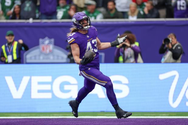 The Vikings' Andrew Van Ginkel celebrates as he scores after making an interception against the Jets on Oct. 6, 2024, at Tottenham Hotspur Stadium in London. (Ian Walton/AP)