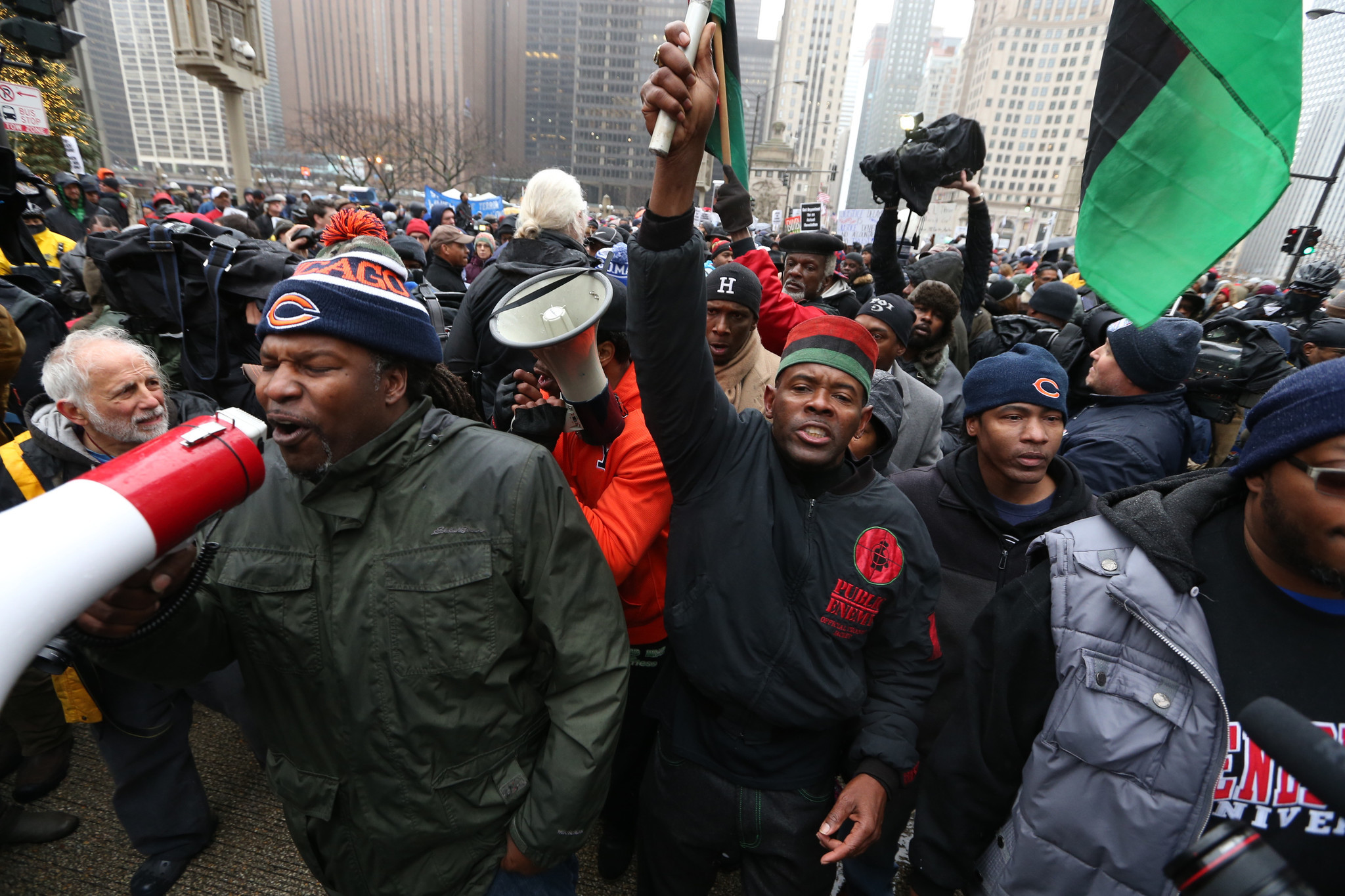 Protesters march north on Chicago's Michigan Avenue on Nov. 27,...