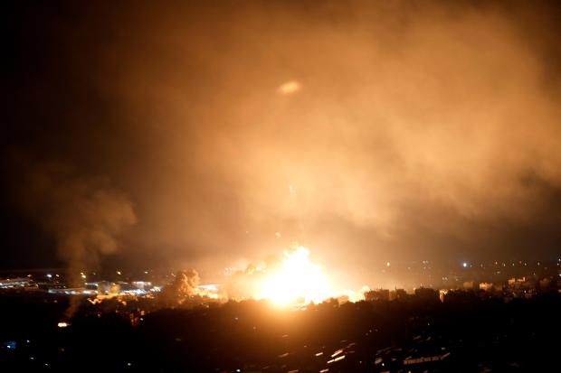 Flames rise from Israeli airstrikes in Dahiyeh, Beirut, Lebanon, Friday, Oct. 4, 2024. (AP Photo/Hussein Malla)