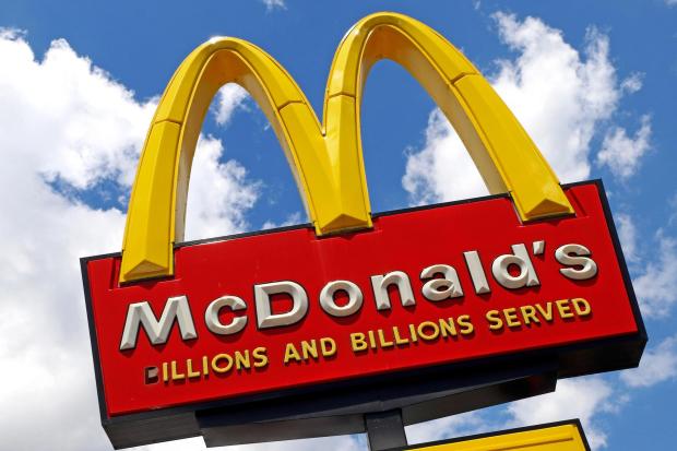 FILE - The sign outside a McDonald's restaurant is seen in Pittsburgh, June 25, 2019. (AP Photo/Gene J. Puskar, File)