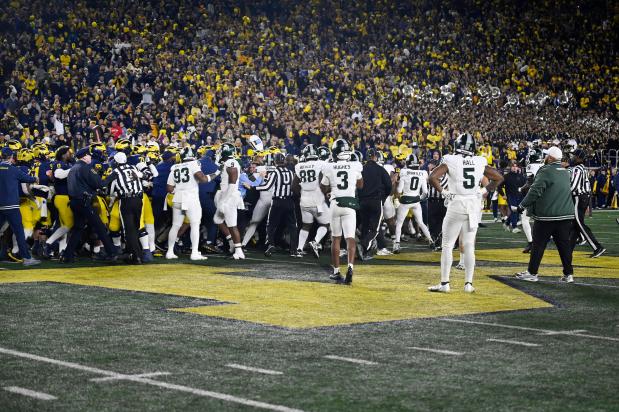 A fight breaks out between Michigan and Michigan State following the game on Oct. 26, 2024, in Ann Arbor, Mich. (AP Photo/Jose Juarez)