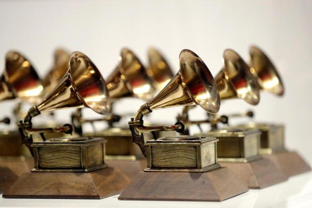 Grammy Awards are displayed at the Grammy Museum Experience at Prudential Center in Newark, N.J. on Oct. 10, 2017. (AP Photo/Julio Cortez, File)