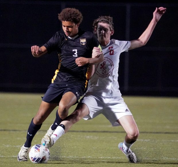 Metea Valley's Anthony Hildreth (3) is challenged by Naperville Central's Eli Jarrell (6) for the ball during a soccer match at Metea High School on Tuesday, Oct 1, 2024. (Sean King / for Naperville-Sun)