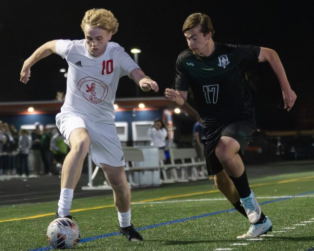 Naperville Central's Ryan Lafferty (10) dribbles down field against Plainfield Central during a Class 3A Naperville North Sectional semifinal game in Naperville on Tuesday, Oct. 29, 2024. (Troy Stolt / for the Naperville Sun)