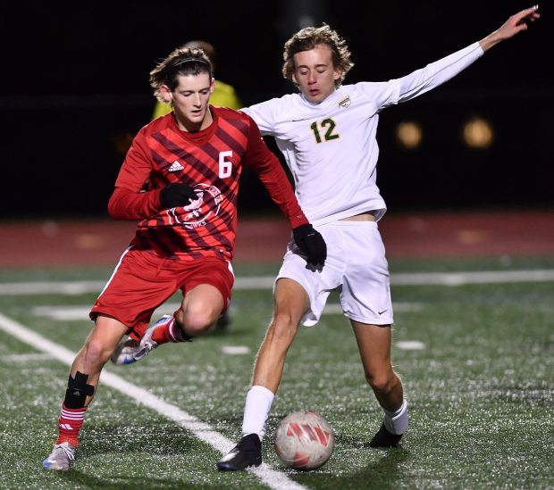 Naperville Central's Eli Jarrell (6) cuts off Waubonsie Valley's Everett Day to steal the ball during a game Tuesday, Oct. 15, 2024 in Naperville...(Jon Cunningham/for The Naperville Sun)