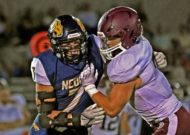 Neuqua Valley's Rocco Dubiel works against a block from Lockport's Tyler Pospisil. Neuqua Valley lost to Lockport in a football game, 41-14, Friday, Sept. 13, 2024, in Naperville, Illinois. (Jon Langham/for Naperville Sun)