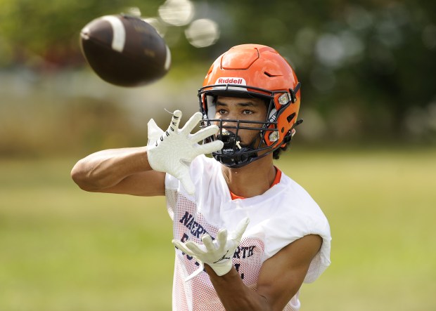 Naperville North's wide receiver Quinn Morris makes the catch during drills with the Huskies offense on Tuesday, Aug. 13, 2024 in Naperville, IL. (Steve Johnston/for the Naperville Sun)