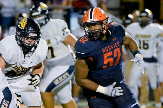 Naperville North's Donavan Howard (52) works the D-line against Neuqua Valley at home in Naperville on Friday, Oct. 11, 2024.  (Mark Black / for the Naperville Sun)