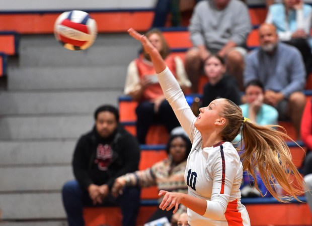 Naperville North's Heidi Mick spikes the ball during a match against Neuqua Valley on Thursday, Oct. 24, 2024 in Naperville...(Jon Cunningham/for The Naperville Sun)