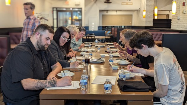 People try out menu items at a TEMPTINN tasting event before the upscale casual restaurant opens in November. (Sujay Karvekar)